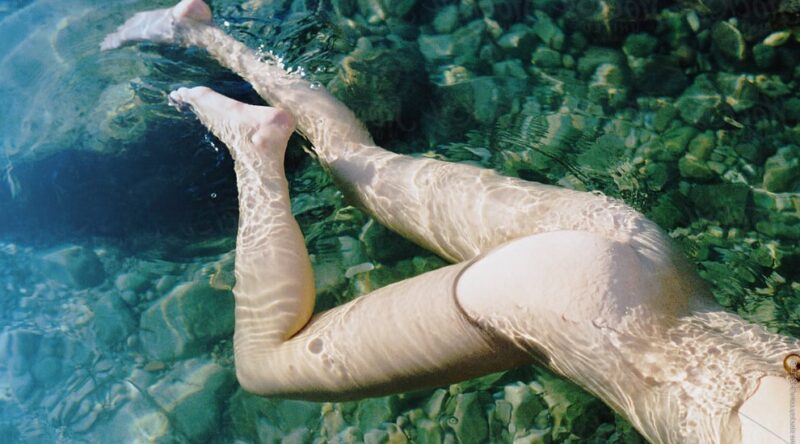 Woman is naked in the water 